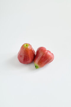 Commercial Photography of Fresh Red Wax Apples with Water Droplets on White Background