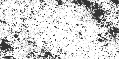 Fototapeta premium A close-up view of dark ink splatter, capturing the abstract textures and patterns, creates a dynamic, grungy artistic impression.
