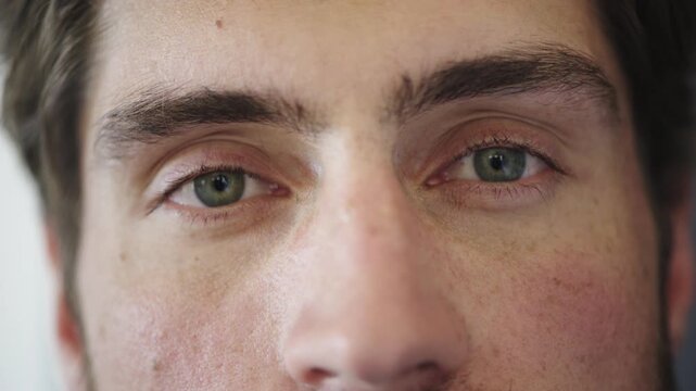 Face, eyes and man with optometry for vision test, ocular health and contact lenses for visual correction. Eye care, portrait and person with myopia check for optical wellness, eyesight exam or blink