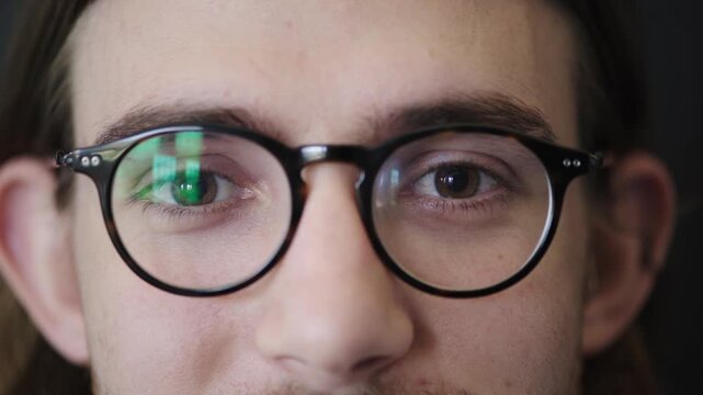 Face, eyes or man with glasses at optometry clinic, eyesight correction or prescription lenses for myopia. Frame test, eye exam or person with specs to improve vision, ophthalmology or ocular health