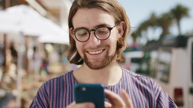 Man, phone and happy with texting in city for travel, glasses and funny chat with online dating. Person, smartphone and click on mobile app for meme, notification or social media with tourism in town