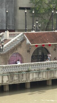Pedestrians Walking Along the Historic Jones Bridge Over Pasig River