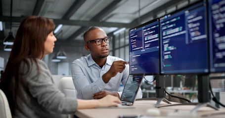 Female Software Developer Codes On Computer