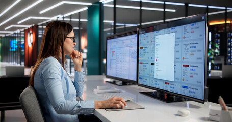 Female Finance Manager Monitors Business Expenses © Andrey Popov