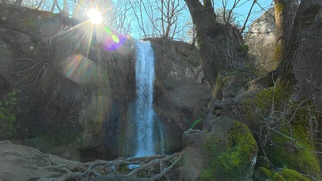 Morning Sun Above Waterfall Behind Tree. Ozren Mountain, Sokobanja region (Ripaljka). Balkans, Serbia.