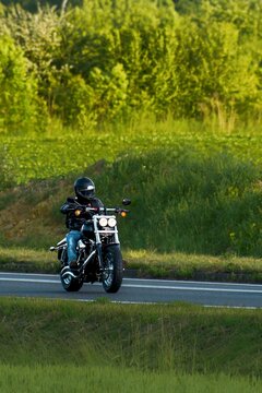 Scenic road trip on a motorcycle through open fields