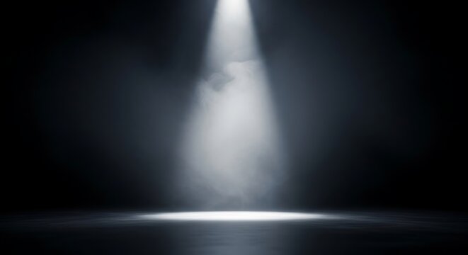 Dramatic single spotlight beam illuminating a smoky dark stage floor