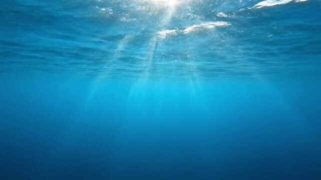 Underwater Light Rays Surfacing in Clear Blue Ocean