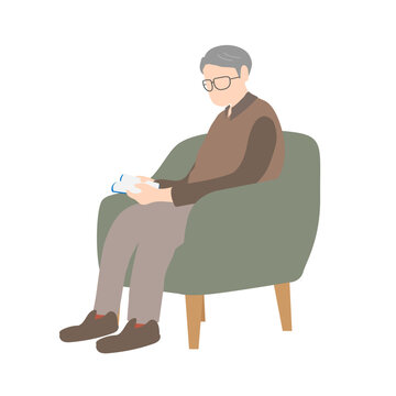 椅子に座って本を読むシニア男性 高齢者の読書シーン