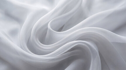 Obraz premium Close-up photograph of delicate, flowing white sheer fabric with soft, elegant curves and ripples creating texture.