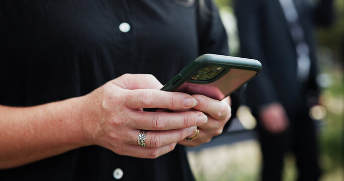 Funeral, hands and woman in graveyard, cellphone for online chatting and post for memory. Family, connection and person in cemetery, smartphone or message to contact or with social media or internet