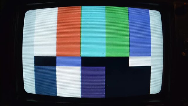 Television static screen, distorted color bars with noise and glitch, old CRT TV display flickering, symbolizing signal loss and retro technology.