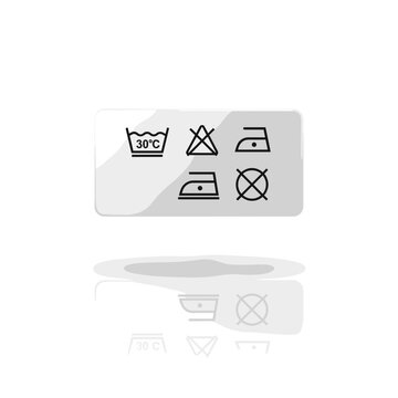 Isolated care label patch with laundry symbols on a reflective white background