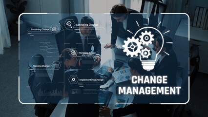 Group of professionals engaged in a business meeting discussing change management strategies with...