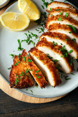 Air fryed chicken meat with herbs and lemon