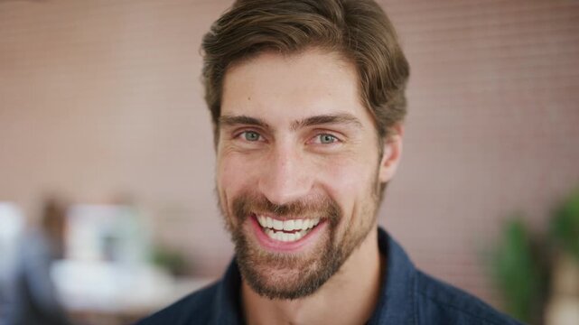 Face, laugh and business man in agency as comedy screenwriter, about us and pride for career. Portrait, funny worker and professional script writer, employee and happy person in creative office