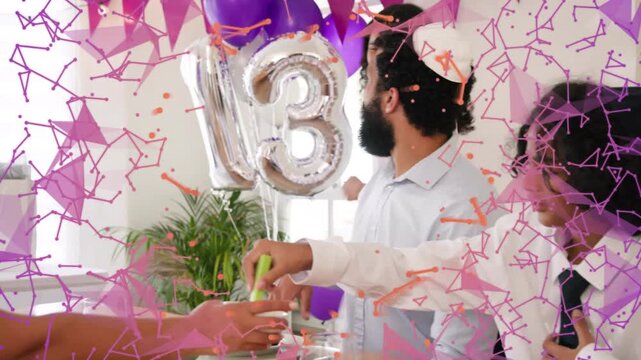 Father sitting at dining table passing green tongs with son, daughter entering hugging at birthday