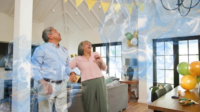 Vertical video: Adjusting couple preparing party at home, following swirl appearing over pennant