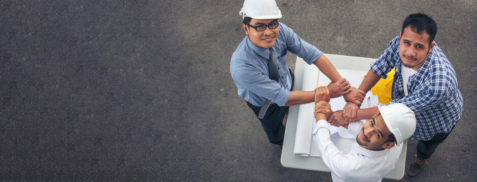 Banner civil construction engineer teams meeting on construction site. Partner team engineering foreman teamwork consult together. Panorama group engineer office meeting partnership with copy space