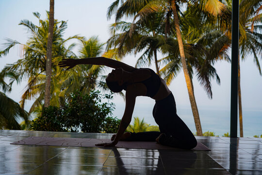 Agonda_Canacona(GOA)-21st MARCH 2026.Silhouette of female doing advance yoga pose.