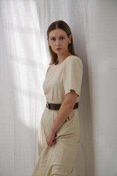Fashionable Woman in Cream Midi A-Line Boucl&eacute; Dress With White Curtains Background &ndash; Elegant Classic Style and Soft Luxury Fashion Concept