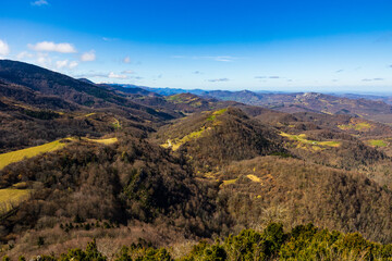 Fototapeta premium Spring panorama over the Ariège mountains with snow-capped peaks from Montségur Castle, France