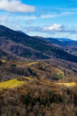 Fototapeta premium Spring panorama over the Ariège mountains with snow-capped peaks from Montségur Castle, France