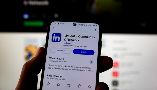 Smartphone Displaying LinkedIn App Page With Enable And Uninstall Options In Mobile Store. Professional Networking Platform Interface Showing Updates Ratings And Features On Android Device Editorial U