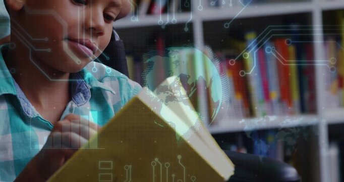 Boy turning yellow book pages, starting hologram globe and circuits fixed to book for education