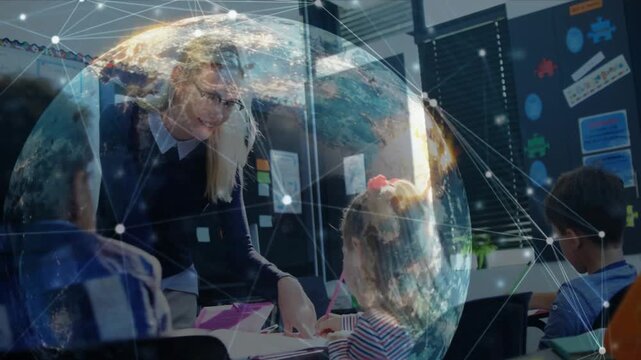 Teacher approaching in class, pointing worksheet and guiding student while globe network rotating