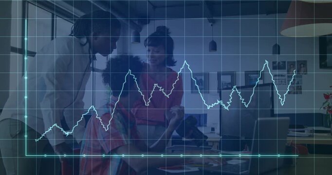 Vertical video: Team in office shirts reviewing data at office, with laptop and teal graph changing