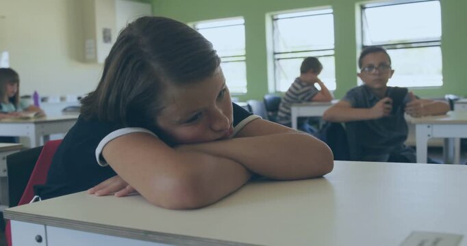 Girl resting head on desk in class, code overlay appearing at start, fading and teaching coding