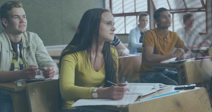 Vertical video: Glancing as overlay drifting, yellow-top student noting in notebook, wristwatch