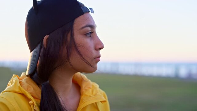 Outdoor, teenager and girl with thinking for holiday, remember memory and peaceful mindset for trip. Wind, space and calm person with reflection for vacation, nature and view location for inspiration