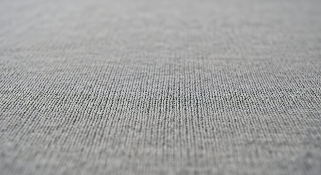 Gray textured background with parallel lines and selective focus perspective.