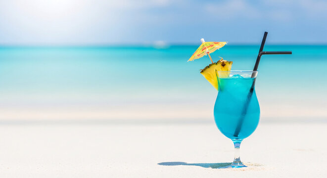 A blue cocktail on a sandy beach