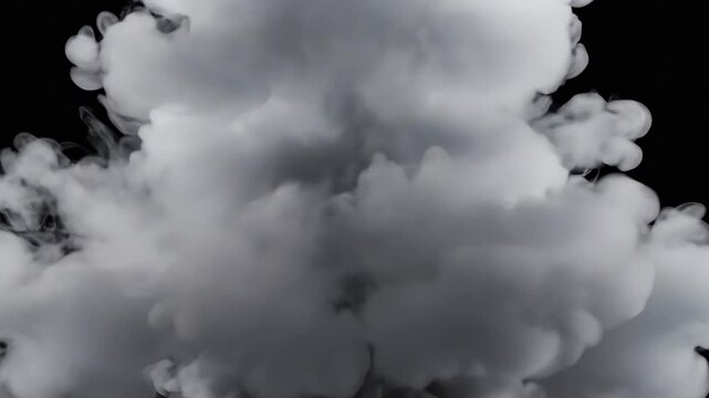A powerful burst of white smoke rapidly expands and dissipates against a dark, isolated backdrop. This dramatic visual effect is perfect for overlays, transitions, or adding intensity to any project.