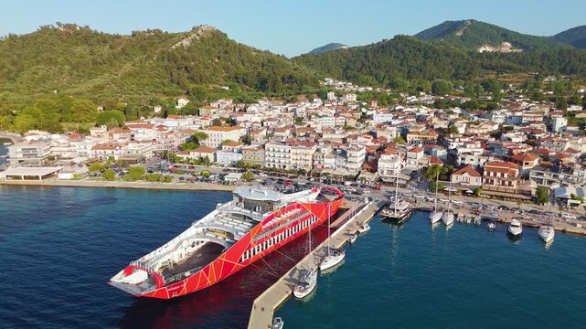 Thasos Town Waterfront with Red Ferry and Mountain Background