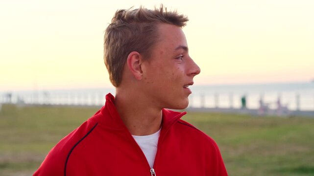 Beach, teenager and boy thinking on holiday, remember positive memory and view location for inspiration. Outdoor, space and calm person with reflection for vacation, nostalgia mindset and sightseeing