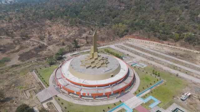 Shri Yantra monument Dongargarh aerial view, Sacred Shri Yantra structure Chhattisgarh landmark, Geometric Shri Yantra sculpture hilltop view, Spiritual Shri Yantra monument with landscape stock video