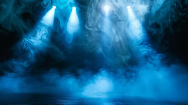Mysterious blue spotlights pierce the thick fog on the dark stage, creating a dramatic backdrop for theatrical productions or concert posters.