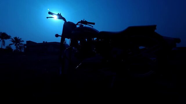 Motorcycle Silhouette at Sunset with Palm Trees Scenic Evening Landscape India