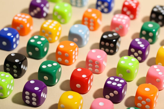 Colorful game dices on beige background
