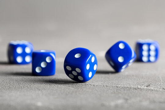 Blue game dices on grey background
