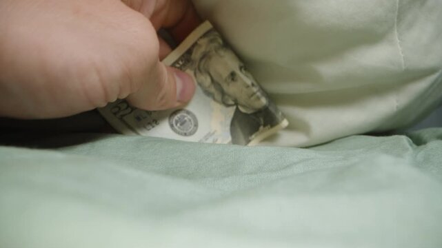 Twenty Dollars Tooth Fairy Places Under the Pillow and Takes the Tooth. First-person Dolly. Close-up.