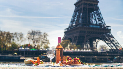 Picnic and wine near the Eiffel Tower. Selective focus.