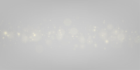 Golden glitter dust bursts into luminous bokeh circles, creating a festive and elegant visual texture. Tiny sparks scatter like shooting stars across the frame. Suitable for premium design projects. © Mirotvoric