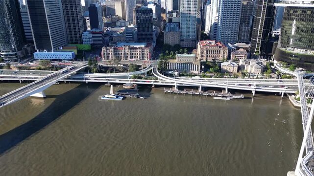 Aerial view of the cityscape of Brisbane, Australia. Urban modern architecture of skyscrapers and business centers in a riverside location.