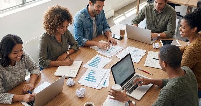 Diverse team collaborative meeting analyzing data