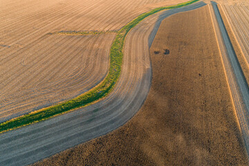 Fototapeta premium 63801-13115 Partially harvested corn field in fall-aerial Marion Co. IL